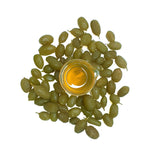 Cellular Extract of Desert Lime light yellow in colour in a beaker with fresh deserts limes surrounded, scientifically known as Citrus glauca