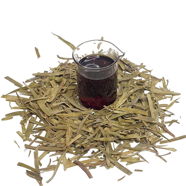 Dried Emu bush surrounds a beaker of NATIVE EXTRACTS Emu Bush Cellular Extract