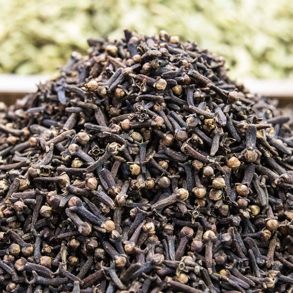 Dried brown cloves, nail like in shape, scientifically known as Syzygium aromaticum (Synonym Eugenia caryophyllus)